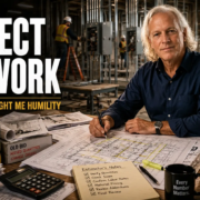 Experienced electrical estimator reviewing commercial plans after learning the importance of accuracy, humility, and respecting the work.